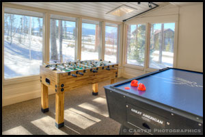 game room with foosball and air hockey